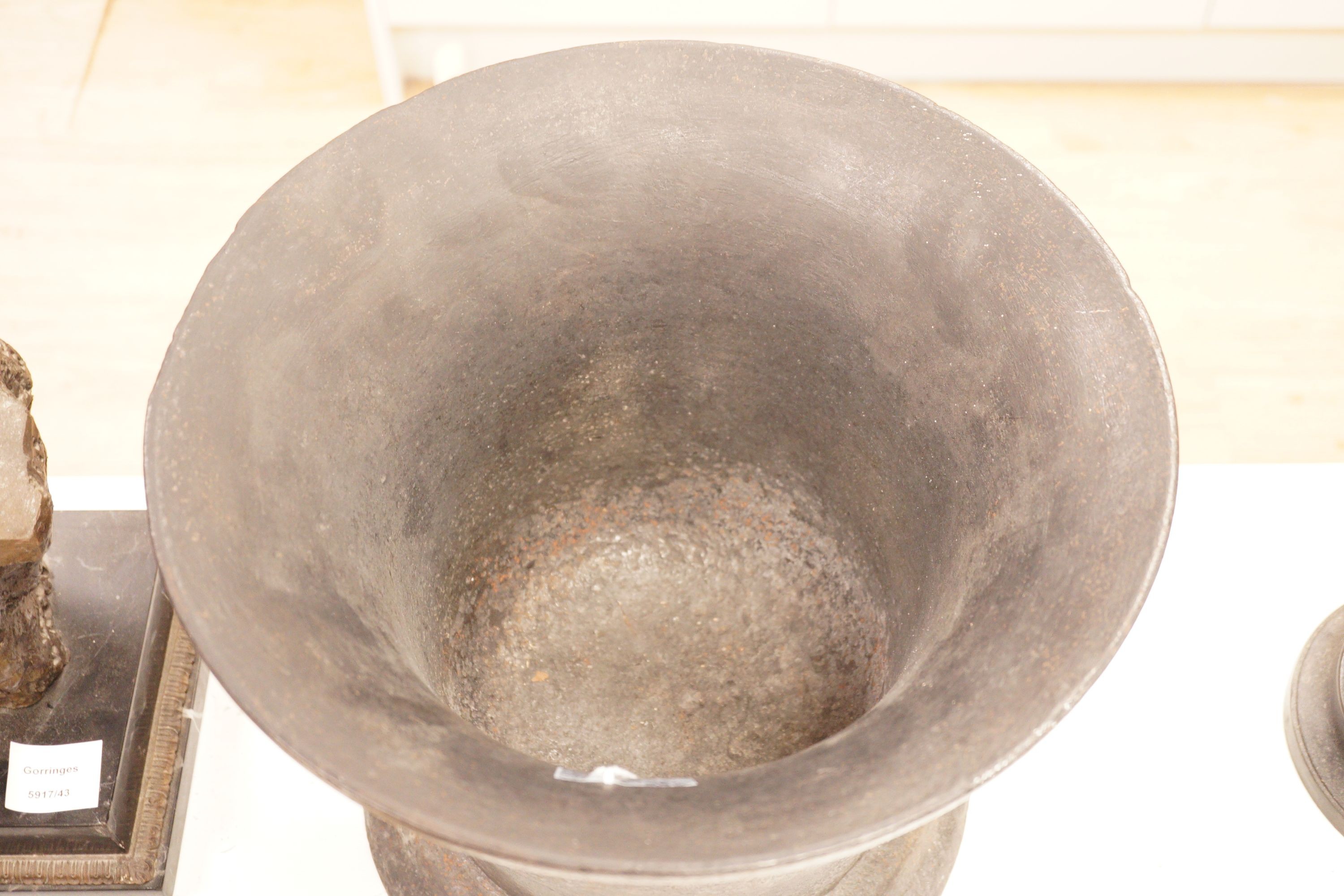 A very large and heavy cast iron mortar, 29cm tall